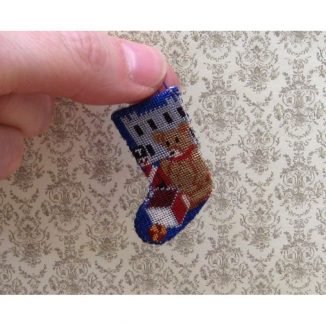 Dollhouse needlepoint Toys for Boys Christmas stocking being held